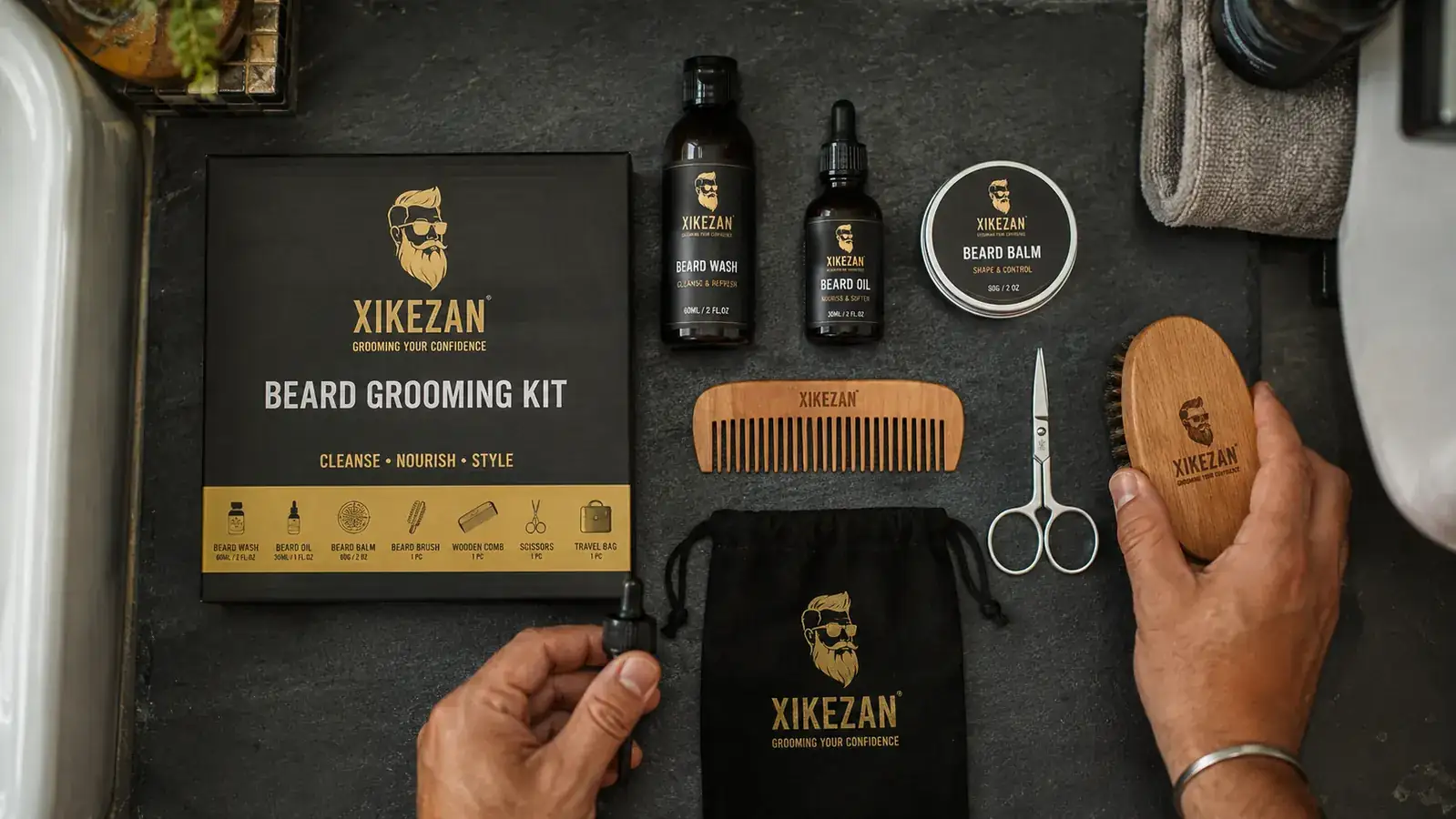Beard grooming kit laid out flat with oil, balm, comb, brush, and scissors arranged neatly