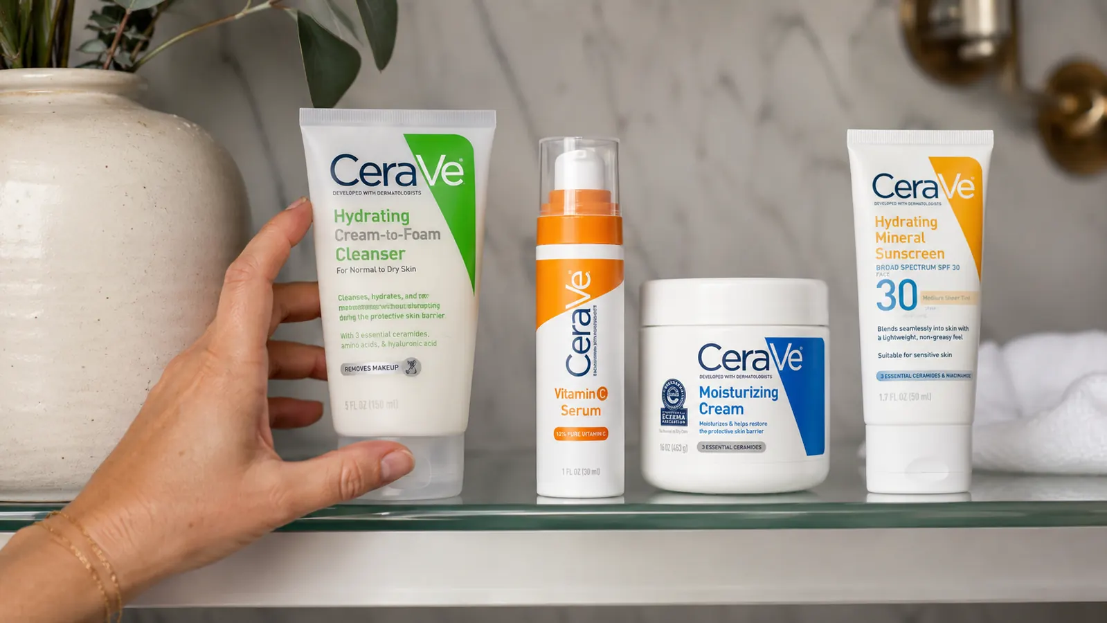CeraVe Vitamin C Serum bottle next to a moisturizer and SPF sunscreen as part of a morning skincare lineup